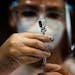 A nurse prepared a dose of the Pfizer COVID-19 vaccine at the Tomas Dones Coliseum, in Fajardo, Puerto Rico, Jan. 8, 2022.