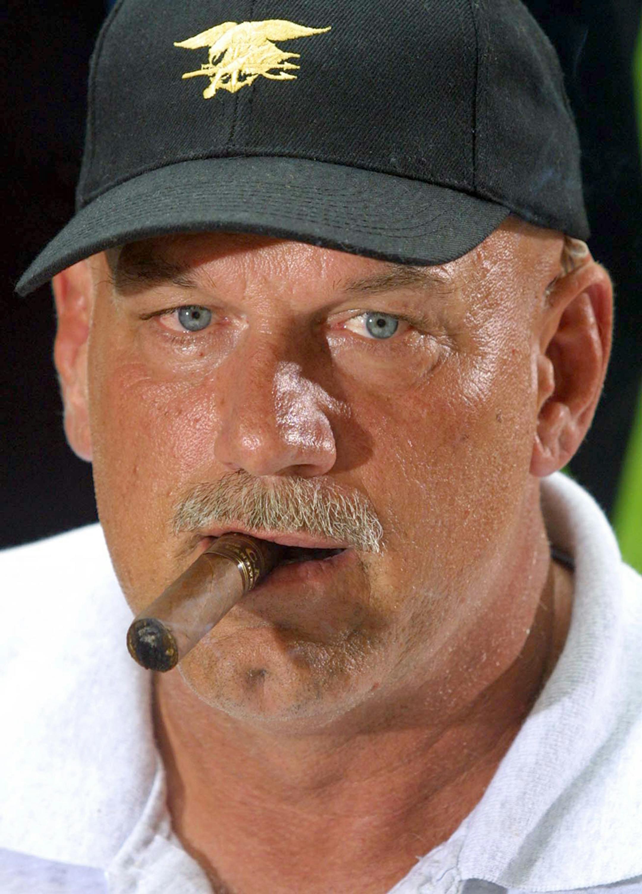 Havana, Cuba--- Minnesota Governor Jesse Ventura, smokes a cigar (NOT a CUBAN) after meeting with the media at The Hotel National de Cuba, in Havana, Cuba on Wednesday. Ventura, arrived in Cuba on Wednesday to attend the U.S. and Agribusiness Exhibition.