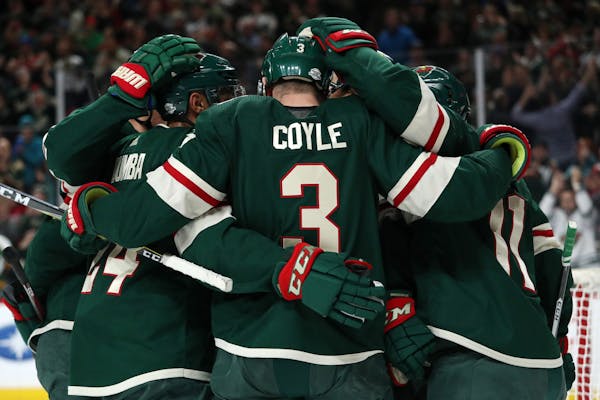 Wild center Charlie Coyle (3) celebrated with teammates after scoring on Vegas goaltender Malcolm Subban on Friday night.