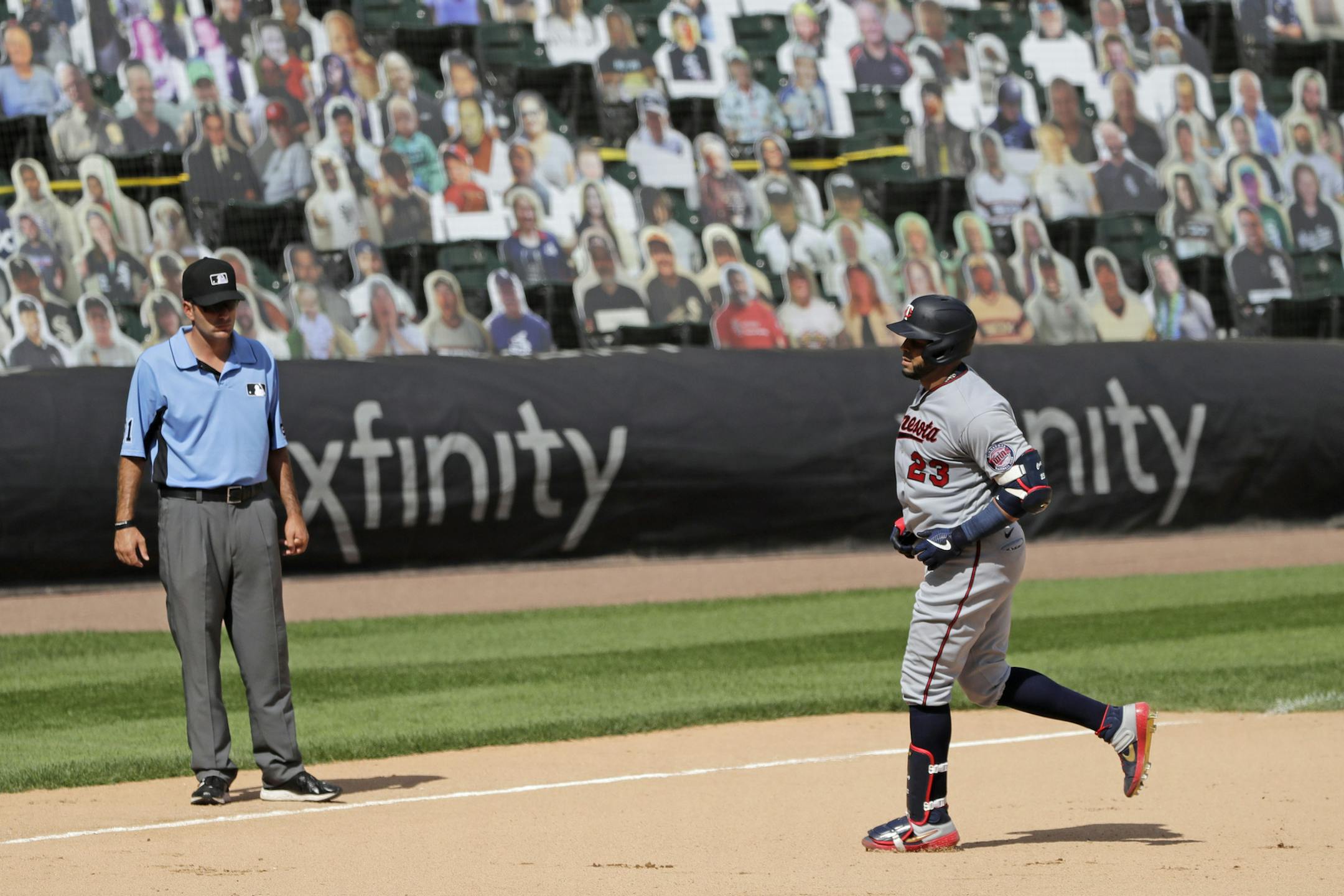 Minnesota Twins' Nelson Cruz rounds the bases after hitting a three-run home run against the Chicago White Sox during the eighth inning of a baseball game in Chicago, Sunday, July 26, 2020. (AP Photo/Nam Y. Huh)
