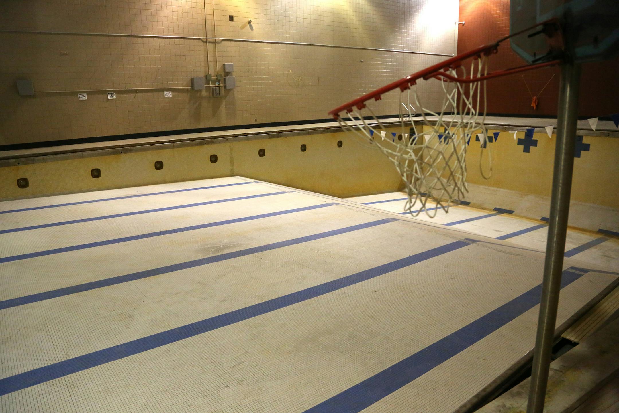 The pool at Phillips Community Center sat empty and closed with a basketball hoop sitting on the side ] (KYNDELL HARKNESS/STAR TRIBUNE) kyndell.harkness@startribune.com During a press conference and tour at Phillips Community Center in Minneapolis April, 25, 2014. Phillips Community Center