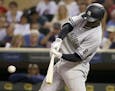 New York Yankees' Didi Gregorius hits a three-run home run off Minnesota Twins relief pitcher Fernando Abad during the seventh inning of a baseball ga