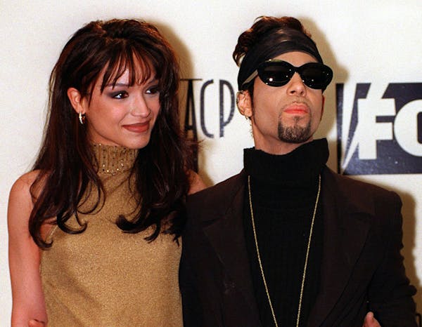 FILE - In this Feb. 8, 1997 file photo, Prince poses backstage with his wife Mayte at the 28th annual NAACP Image Awards in Pasadena, Calif. Prince di
