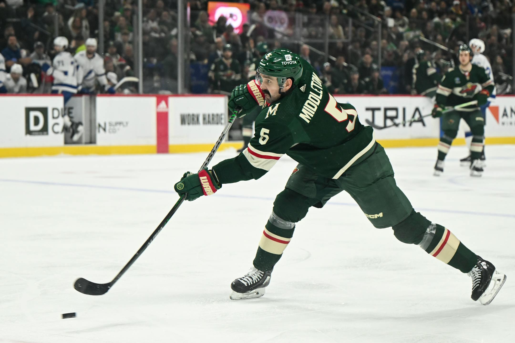 Minnesota Wild defenseman Jake Middleton (5) attempts a shot against the Tampa Bay Lightning during the first period Thursday, Jan. 4, 2024 at Xcel Energy Center in St. Paul, Minn.. ] AARON LAVINSKY • aaron.lavinsky@startribune.com