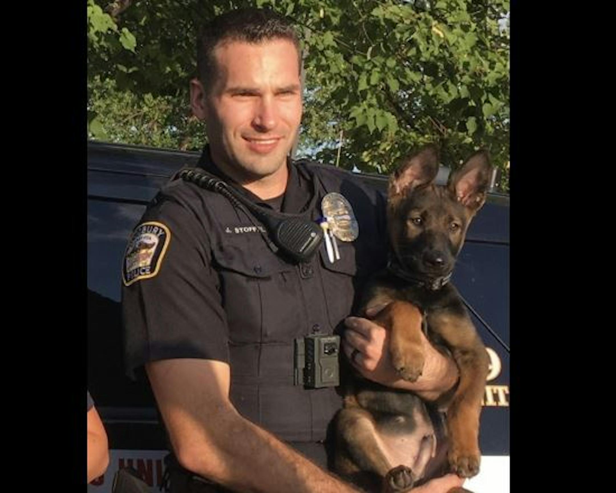 Officer James Stoffel and K-9 cadet Buster.