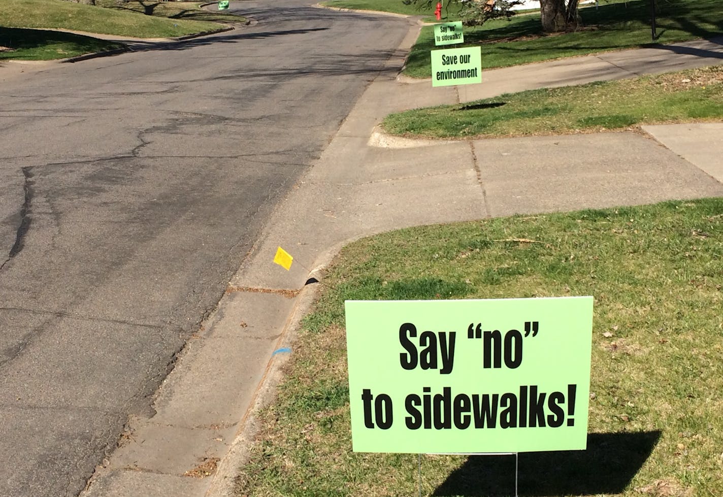 Residents of the Aquila neighborhood in St. Louis Park protested plans for sidewalks, but the City Council went ahead unanimously.