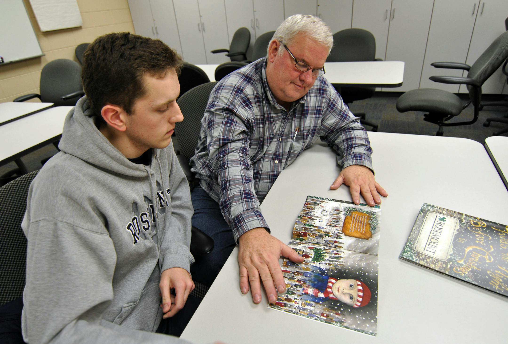 Photo by Liz Rolfsmeier Rosemount High senior Andre Nelson and Rosemount High English teacher Chuck Brooks collaborated on and recently published ì'Twas the Night Before Christmas in Rosemount.î