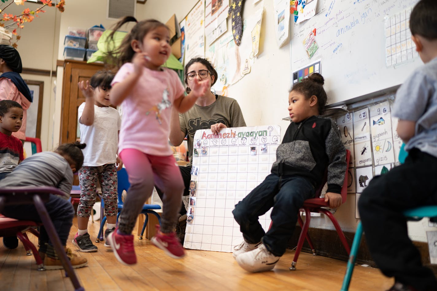 Led by Ojibwe teacher Liz Zoongwegiizhigook Zinsli, each student gets to dance as the class sings in Ojibwe "Hello, How are you, I am feeling good, how about you?" The Ojibwe immersion class is for students from 18 months to 5 years old, at Four Directions school.