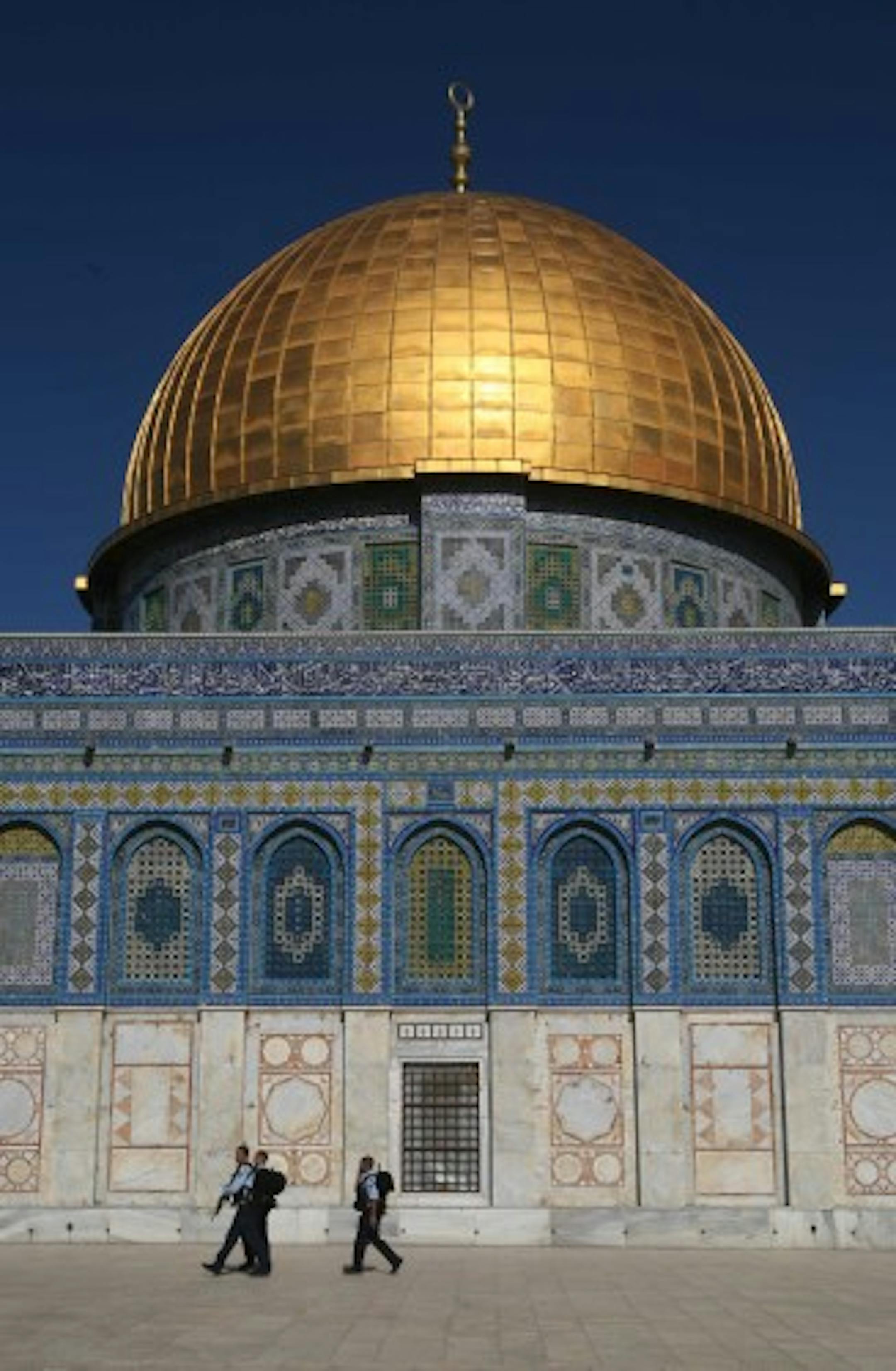 Israeli policemen are seen walking, back-dropped by the Dome of the Rock Mosque in the Al Aqsa Mosque compound in Jerusalem's Old City, Tuesday, Nov. 27, 2007. Israeli and Palestinian leaders agreed Tuesday at a peace conference in Annapolis, Maryland, to immediately resume long-stalled peace talks with the aim of creating an independent Palestinian state by the end of next year. (AP Photo/Dan Balilty)