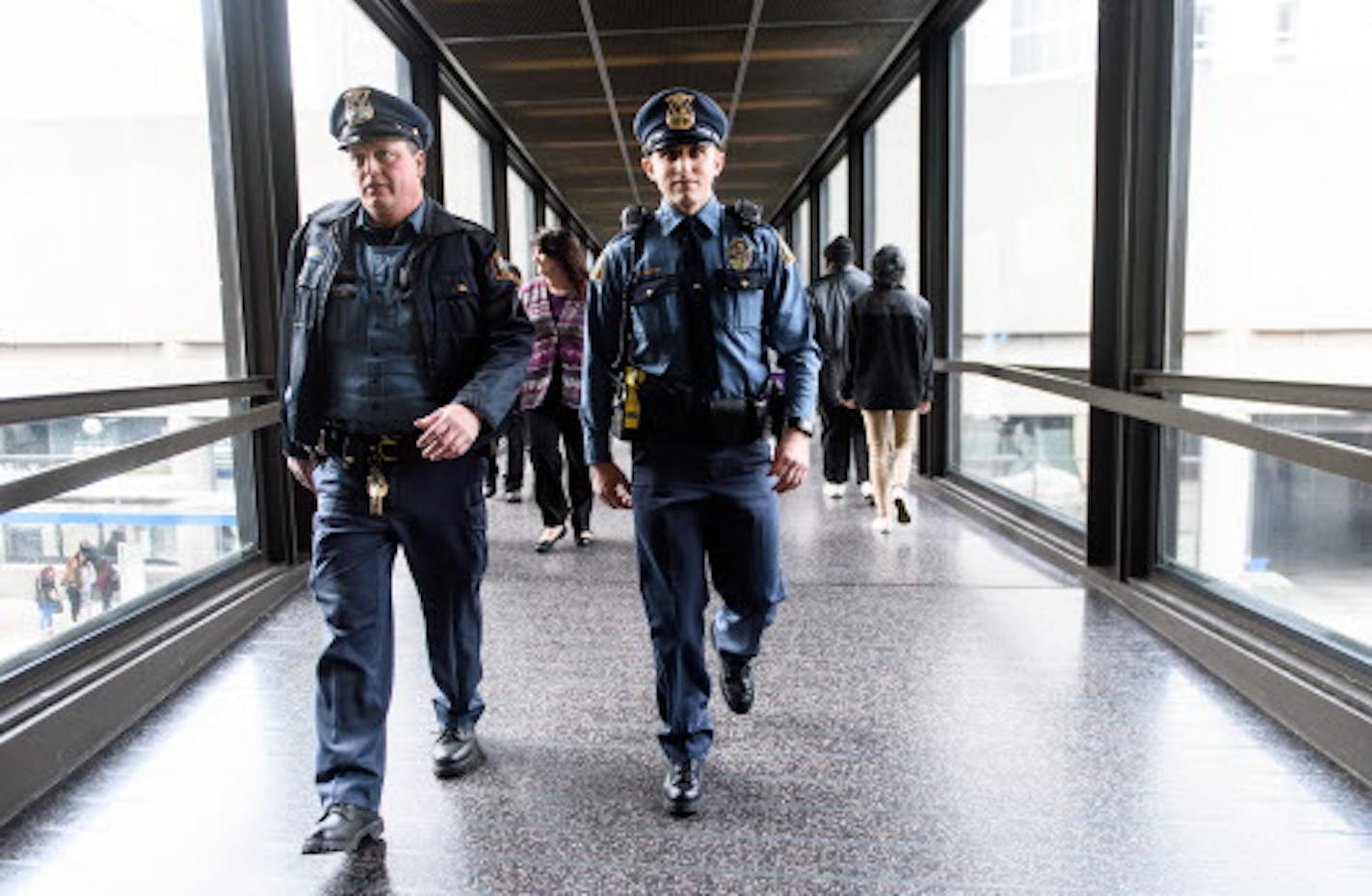 St. Paul Police officer-in-training Eric Hanson, right, and Officer Bruce Schmidt patrolled the skyway in downtown St. Paul on Thursday, Jan. 26, 2017. ] (AARON LAVINSKY/STAR TRIBUNE) aaron.lavinsky@startribune.com A look at skyway safety issues in downtown St. Paul. A city advisory committee will meet about the issues this Friday. We're pulling stats for crimes in the skyway and on downtown city streets. Police say overall crime is down downtown but quality of life issues are up. We follow St.