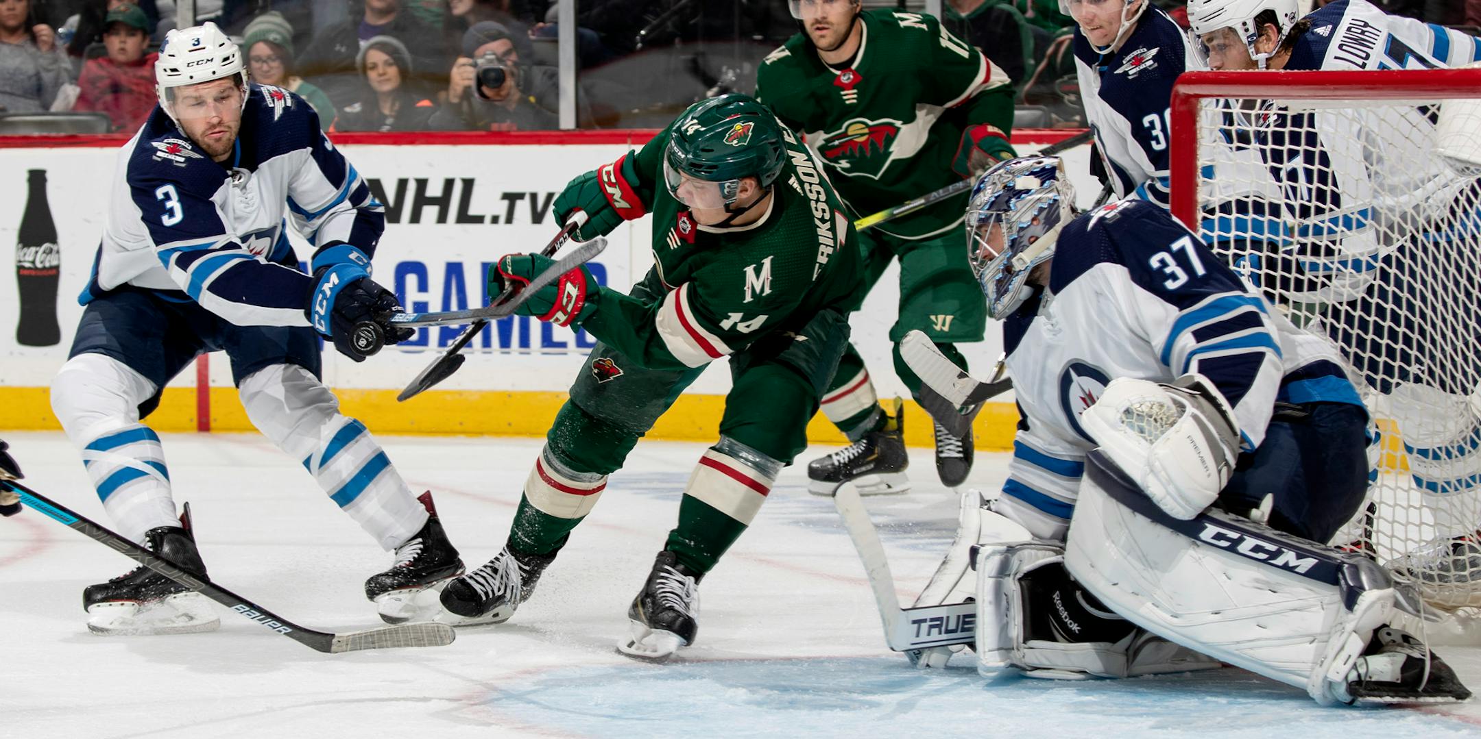 Tucker Poolman of the Winnipeg Jets and Joel Eriksson Ek of the Minnesota Wild fought for the puck in the second period. ] CARLOS GONZALEZ • cgonzalez@startribune.com – St. Paul, MN – September 29, 2019, Xcel Energy Center, NHL Pre Season Hockey, Minnesota Wild vs. Winnipeg Jets
