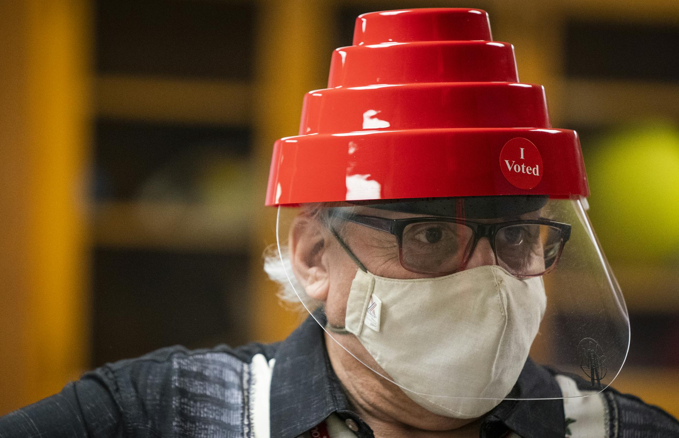 Diego Vazquez Jr. an election judge at St. Matthews Social Hall in St. Paul, wore a festive Devo hat with a face shield while working at the polling place. ] LEILA NAVIDI • leila.navidi@startribune.com BACKGROUND INFORMATION: Voting in St. Paul on Election Day on Tuesday, November 3, 2020.