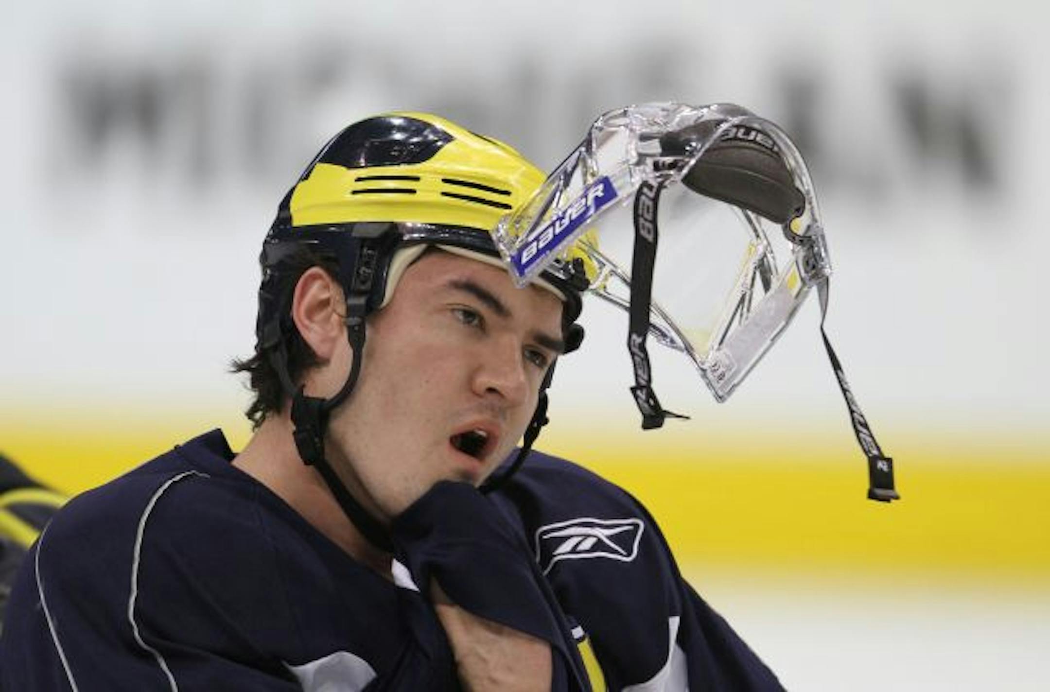 Michigan's Chad Langlais, a senior defenseman, took a break during practice in preparation for tonight's semifinals.