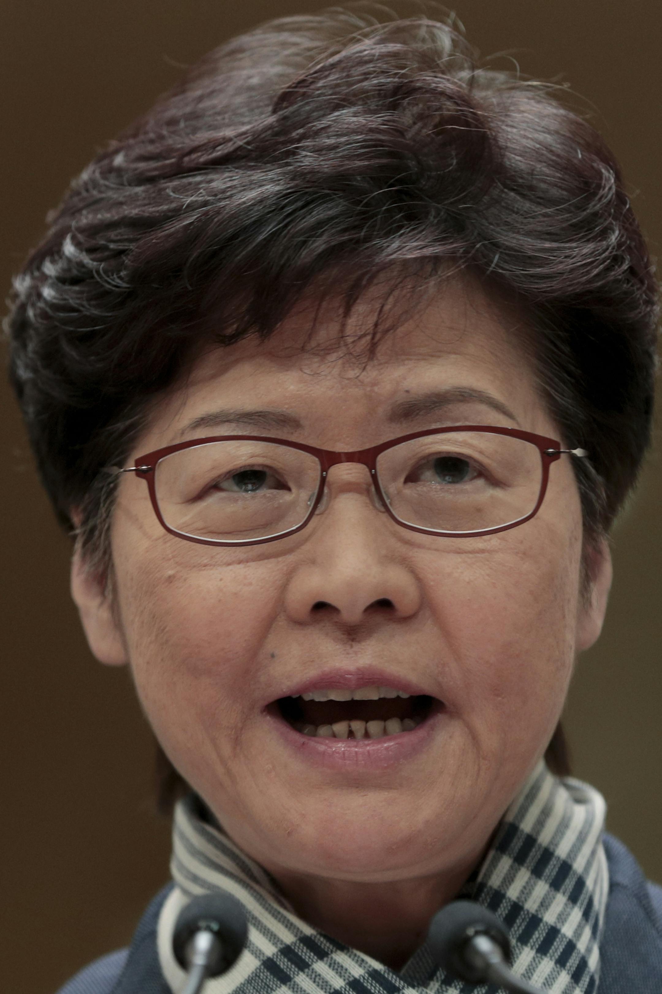 Hong Kong Chief Executive Carrie Lam speaks during a press conference in Hong Kong, Monday, Nov. 11, 2019. A protester was shot by police Monday in a dramatic scene caught on video as demonstrators blocked train lines and roads in a day of spiraling violence fueled by demands for democratic reforms. (AP Photo/Dita Alangkara)
