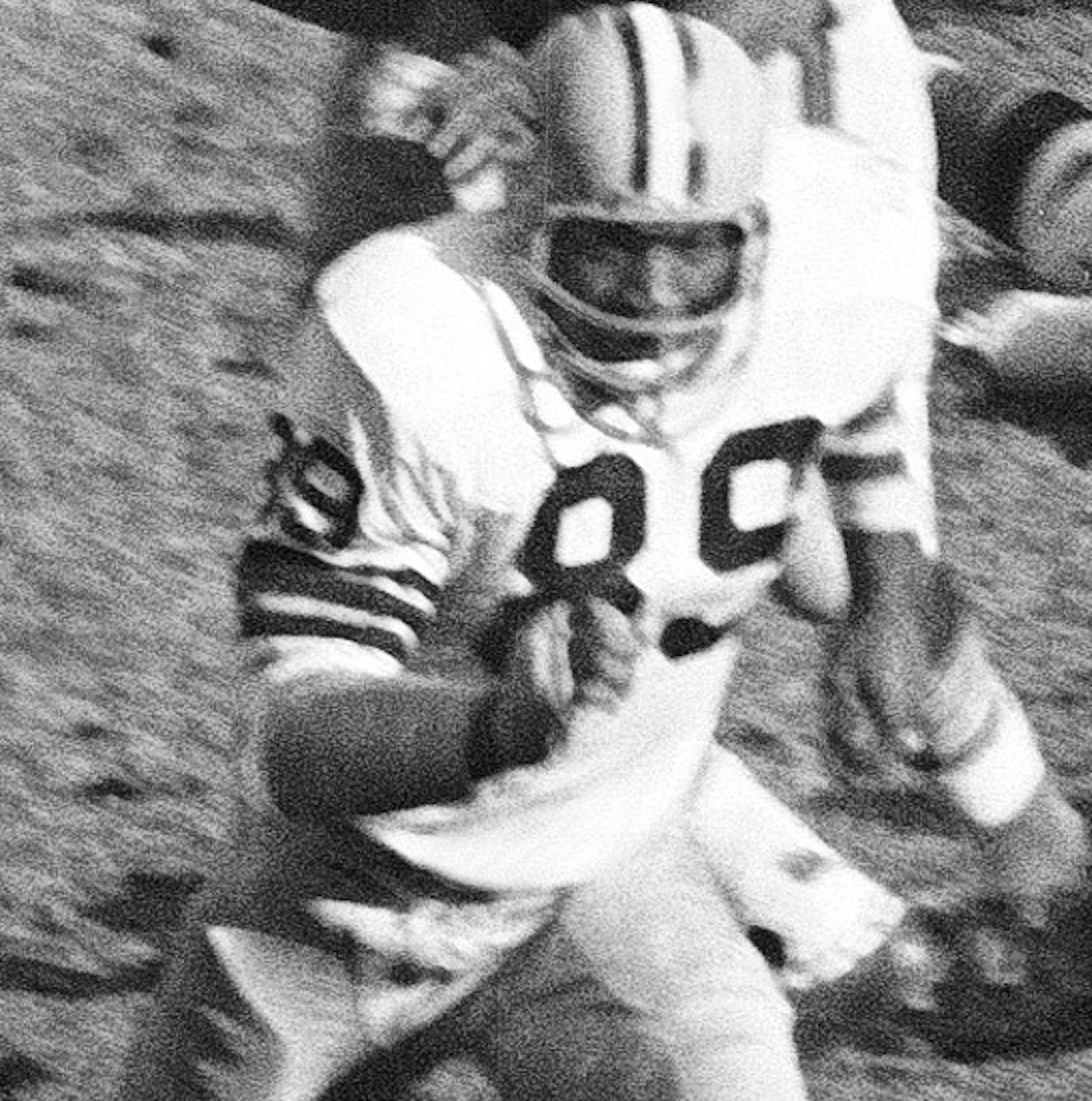 FILE - In this Nov. 27, 1967, file photo, Green Bay Packers Dave Robinson (89) chases Chicago Bears' Gale Sayers (40) during an NFL football game in Chicago. Now a member of the both the College and Pro Football Hall of Fames, Robinson formed one of the greatest linebacking corps in NFL history along with Ray Nitschke and Lee Roy Caffey while he played for the Green Bay Packers. The three-time Pro Bowler was the second African-American player to ever be drafted in the first round by the Packers.