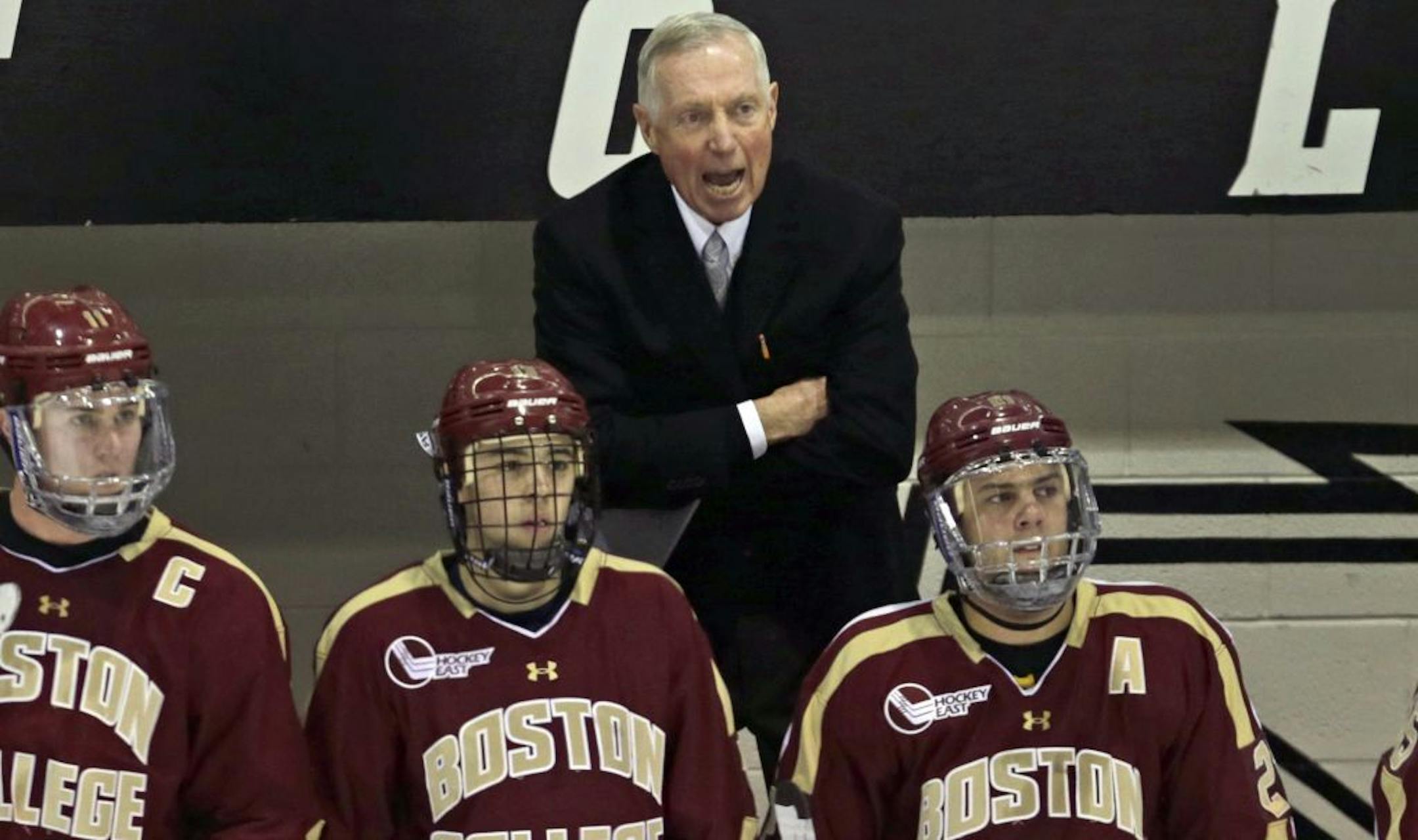 Boston College coach Jerry York calls in at his players during the first period against Providence College in an NCAA college hockey game in Providence, Rhode Island, Friday, Dec. 7, 2012. With 924 career victories, the BC hockey coach is tied with Ron Mason atop college's all-time win list.