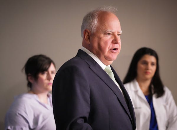 Gov. Tim Walz discussed his support of abortion rights in a press conference. Behind Walz are Maggie Meyer, executive director of Pro-Choice Minnesota