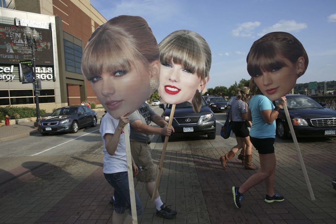 Taylor Swift fans crossed Kellogg Boulevard outside the Xcel Energy Center before a concert in 2013. The Minnesota Wild wants to hang a giant temporary banner on the Kellogg side of the arena.