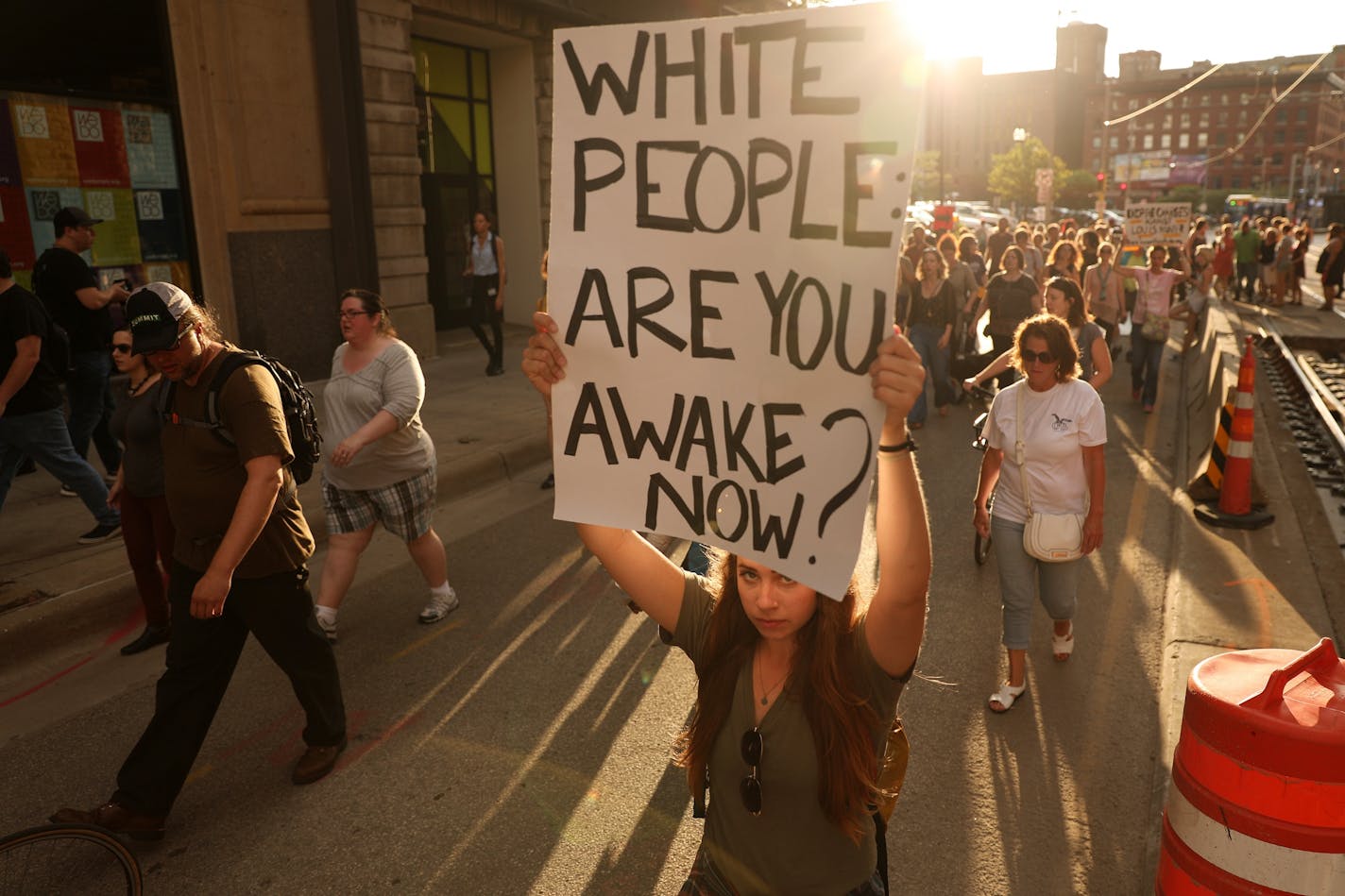 Protesters carried signs as they marched from Loring Park to City Hall.