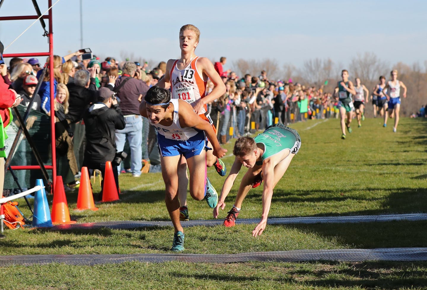 Declan Dahlberg of Mounds Park Academy edges out Matt Steiger of La Crescent (right) and Carl Kozlowski of Lake City to win the Class 1A boys' cross-country meet on Saturday at St. Olaf College. "I didn't have anything left,'' Dahlberg said. "It was unbelievable.''