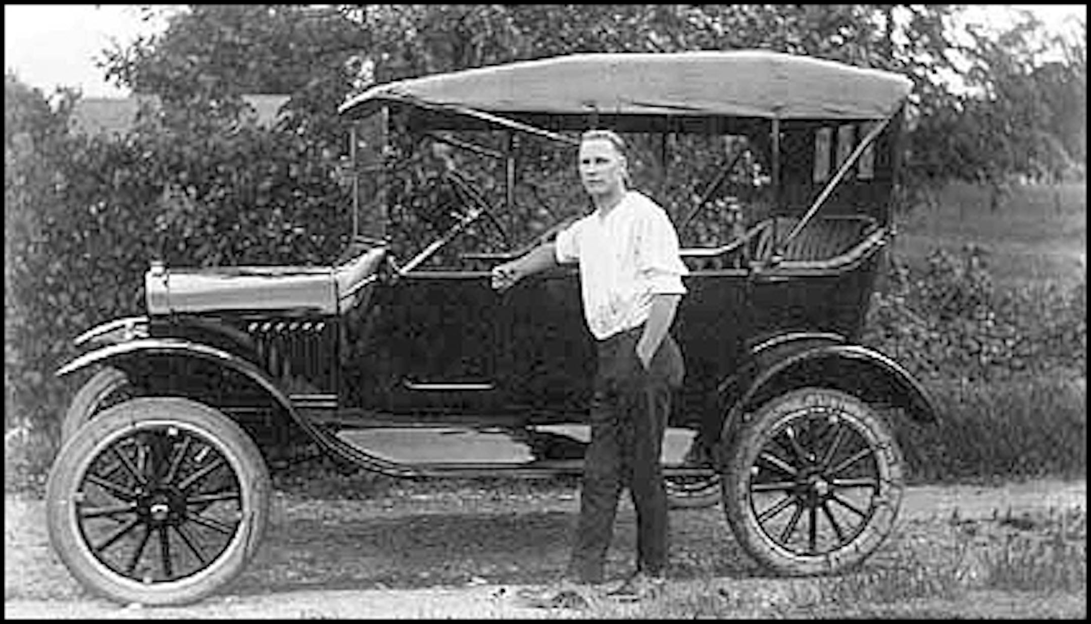 Paul C. Buetow with his new Ford, 1921