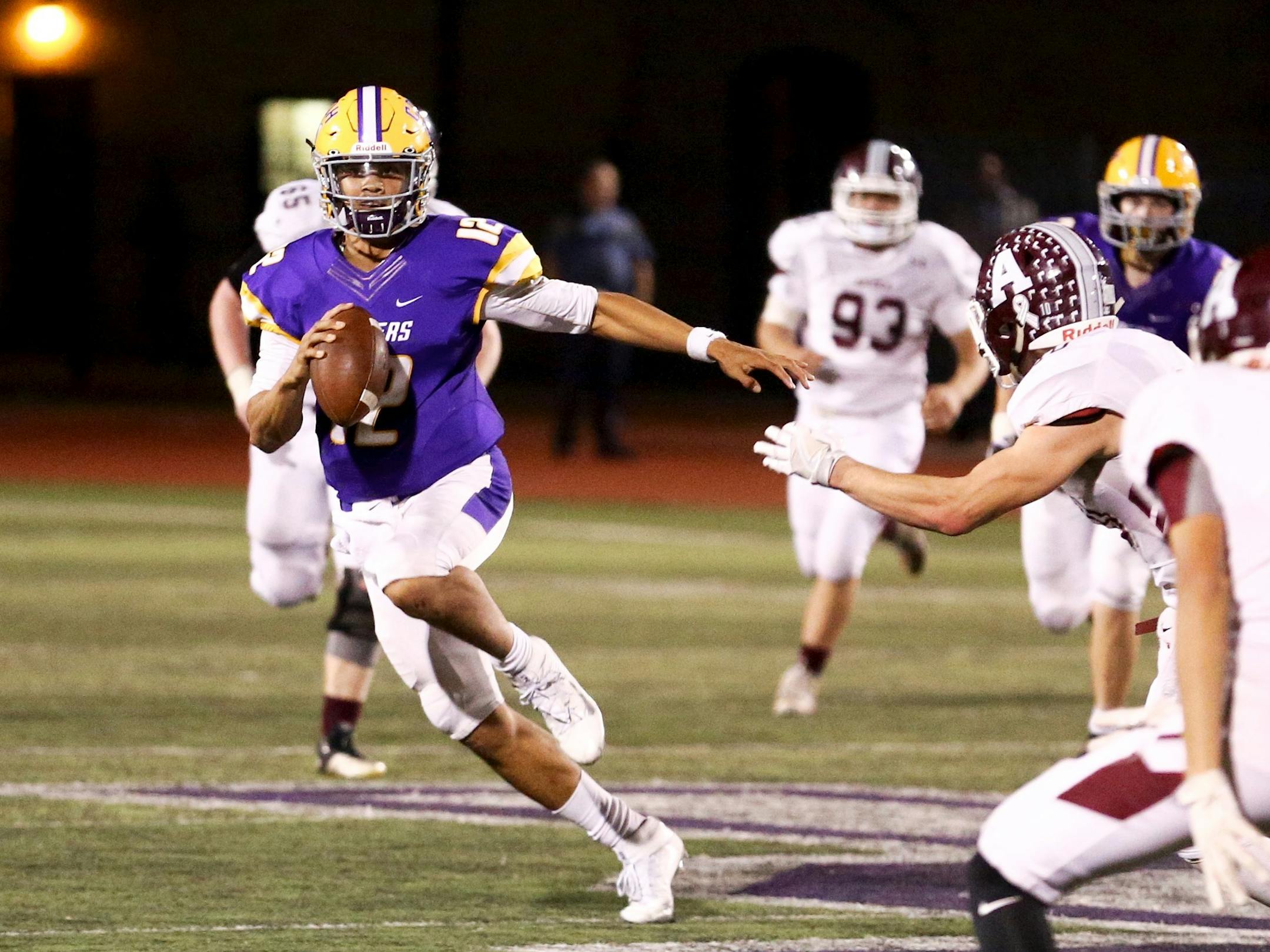 Cretin-Derham Hall QB Jackson Crawford threw for two touchdowns and ran for a nice gain on this play against Anoka as the Raiders go on to win 21-20 in State Tournament action at the University of St. Thomas.