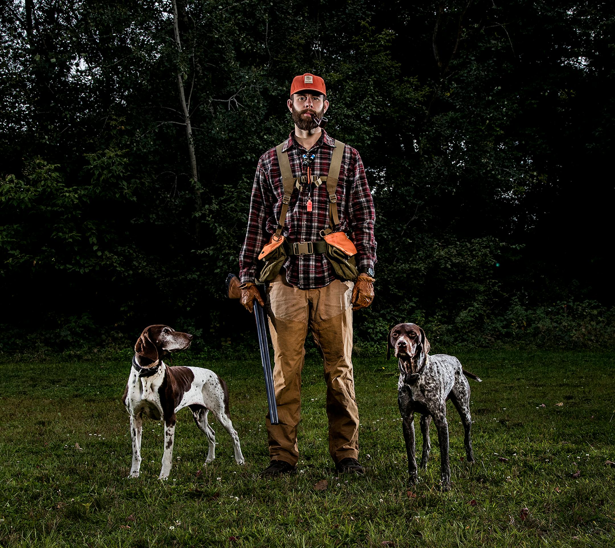 Grouse hunter Garrett Mikrut of Circles Pines with his German shorthaired pointers Stella and Surly. ] CARLOS GONZALEZ • cgonzalez@startribune.com - September 6, 2017, Circle Pines, MN, Catching up with a grouse hunter, Garrett Mikrut of Circles Pines, and checking on his gear list for this season
