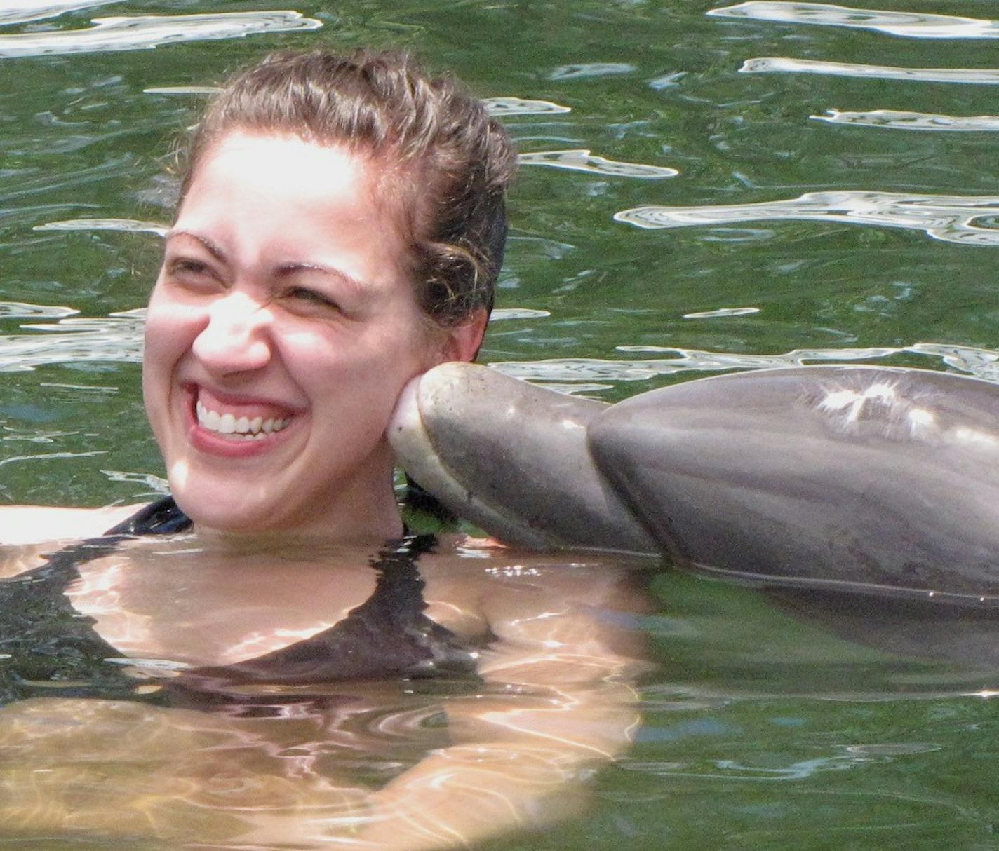 A dolphin gives a smooch to Cara Nash of Nashville during a 30-minute swim at Islamorada&#xed;s Theater of the Sea. ] photo by LISA MEYERS MCCLINTICK/Special to the Star Tribune