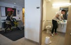 (Left) Beth Lisak, a housekeepr in the apartments on the College of St. Scholastica's campus, and Corey Bullheller, a senior, worked on deep cleaning 