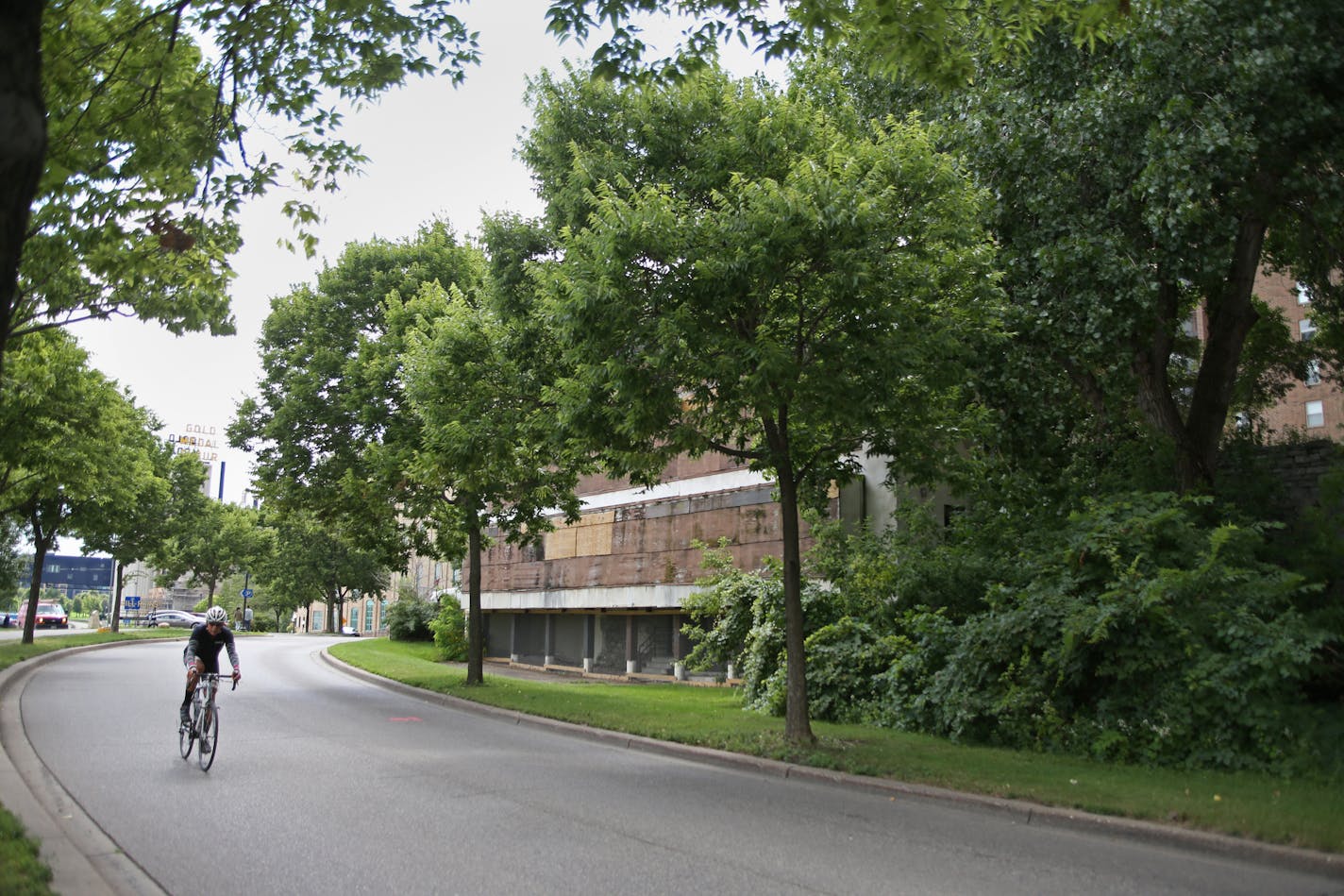 A bicyclist sped along West River Road next to the site where Fuji-Ya operated and where the Water Works development through the RiverFirst Initiative will bring a new restaurant, park, and access to the Mississippi River from 1st Street.] Shari L. Gross &#xef; sgross@startribune.com Minneapolis Park Board officials show potential site of Water Works park, alongside the riverfront, including archeology of the former Fuji-Ya restaurant site on Thursday, August 10, 2017.