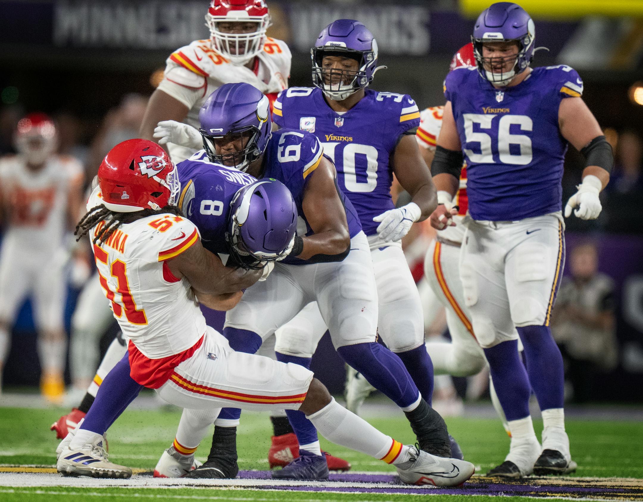 Minnesota Vikings quarterback Kirk Cousins (8) was sacked on the last play of the game by Kansas City Chiefs defensive end Mike Danna (51).