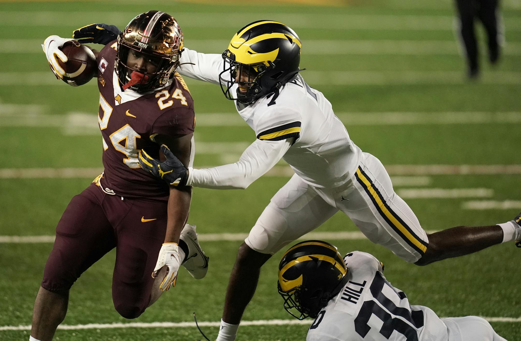 Minnesota Gophers running back Mohamed Ibrahim (24) ran for a touchdown against Michigan Wolverines defensive back Makari Paige (7) in the first half. ] Mark Vancleave Ð The Minnesota Gophers played the Michigan Wolverines on Saturday, Oct. 24, 2020 at TCF Bank Stadium in Minneapolis. ORG XMIT: MIN2010241954000148
