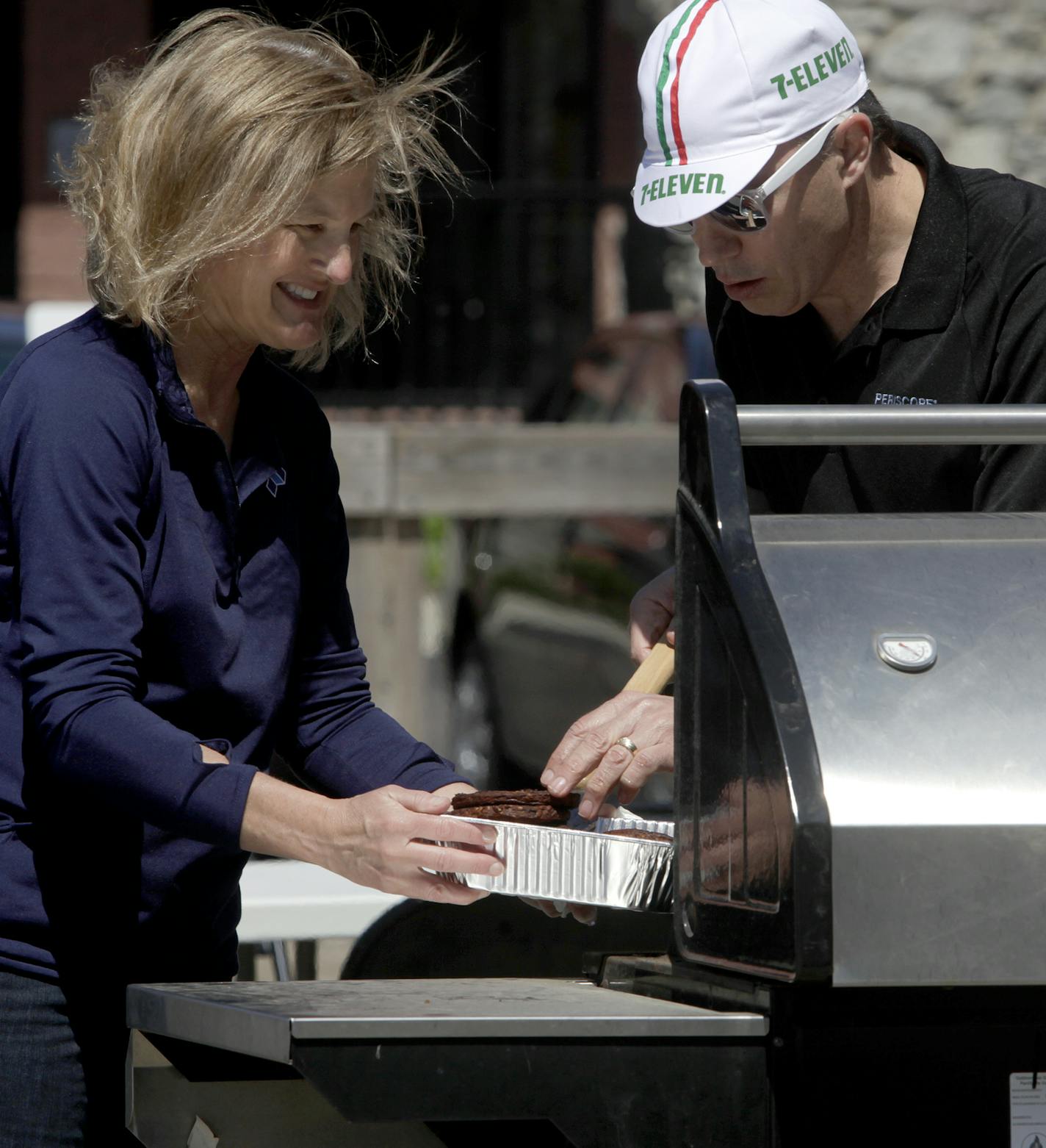 CEO Greg Kurowski, COO/CFO Virginia Hines made burgers for their employees in the parking lot of their office of Periscope ad agency at 921 Washingotn Ave. South, Minneapolis, MN on May 23, 2013. ] JOELKOYAMA&#xe2;&#x20ac;&#xa2;joel koyama@startribune.com A look at what makes the small-sized top JT Mega Food Marketing, an independent ad agency founded in 1976 and focused on the food industry, strives to offer a family-like, transparent culture in which employees have decision-making responsibili