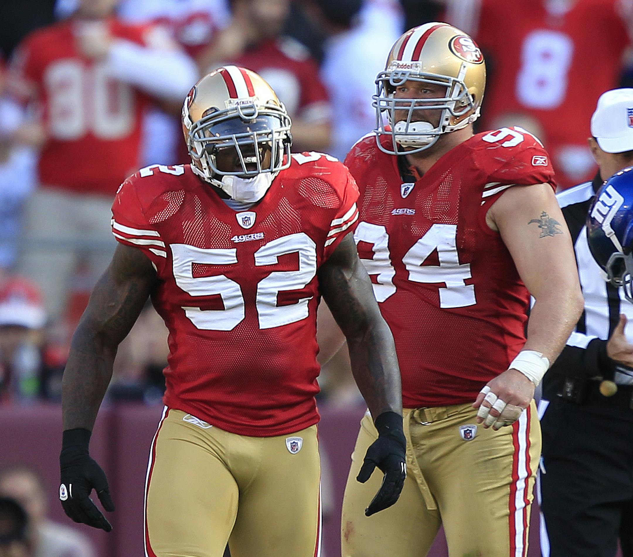 San Francisco 49ers linebacker Patrick Willis (52) celebrates with defensive tackle Justin Smith (94) after sacking New York Giants quarterback Eli Manning in an NFL football game in San Francisco, Sunday, Nov. 13, 2011. (AP Photo/Marcio Jose Sanchez) ORG XMIT: NYOTK