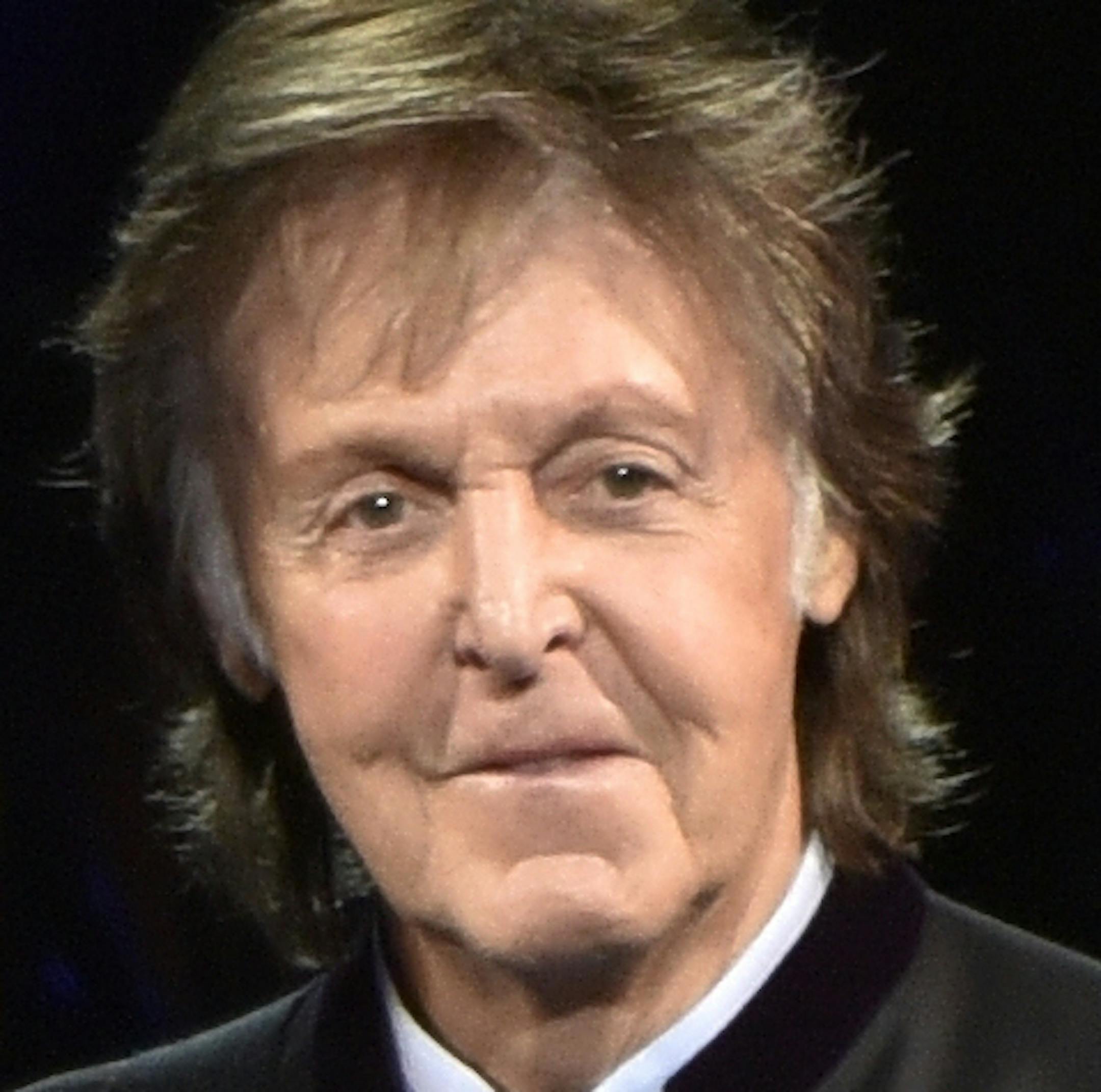 FILE - In this July 26, 2017, file photo, Paul McCartney performs on the One on One Tour at the Hollywood Casino Amphitheatre in Tinley Park, Ill. It was a magical mystery tour as McCartney led James Corden through his hometown during a ìCarpool Karaokeî segment on CBSí ìLate Late Show.î The program on Thursday, June 21, 2018, wrapped up a weeklong stay in London and the Beatles legend joined Corden for a drive around Liverpool. (Photo by Rob Grabowski/Invision/AP, File)