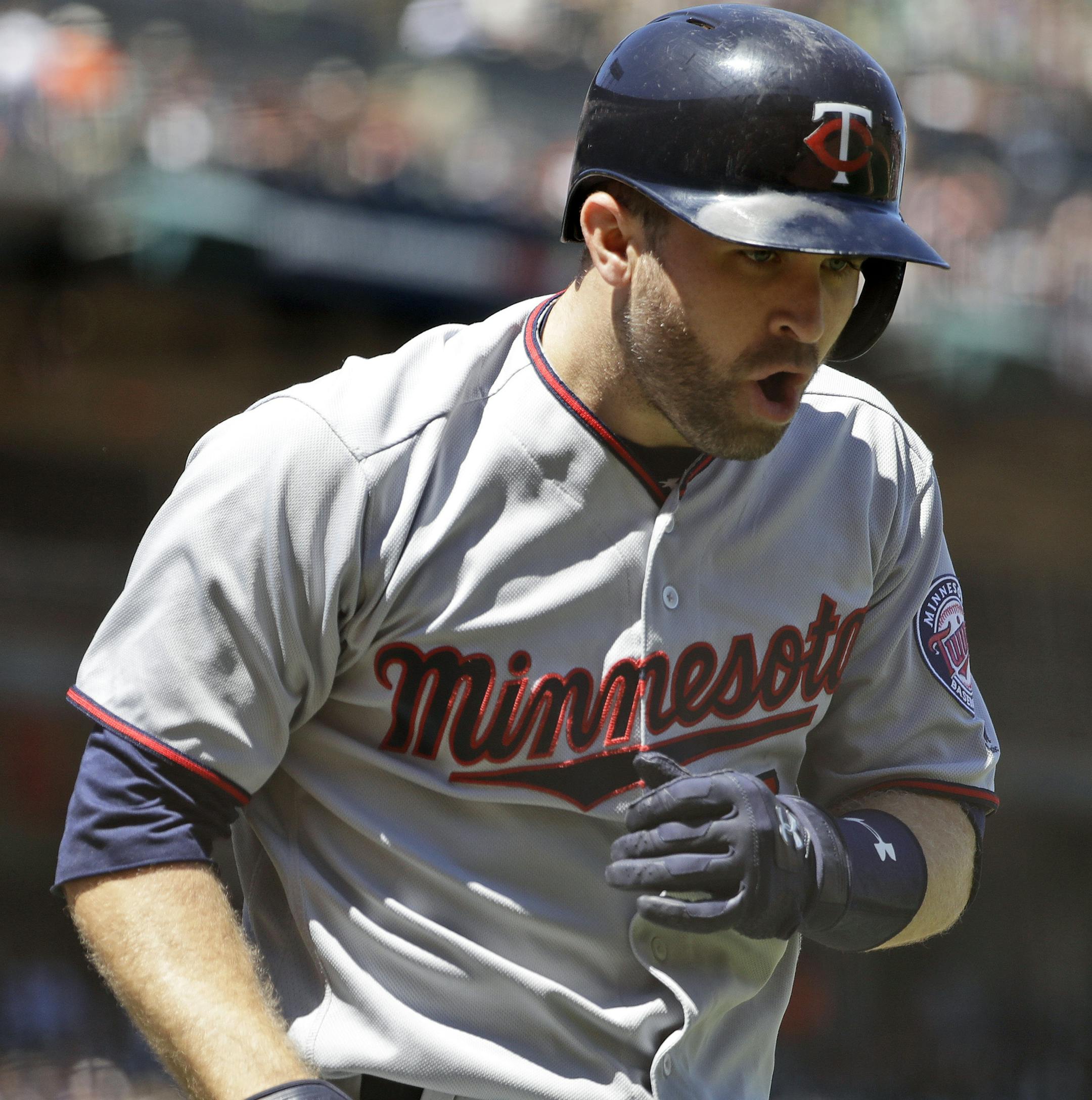 Minnesota Twins' Brian Dozier celebrates as he runs back to the dugout following his two-run home run against the San Francisco Giants during the fifth inning of a baseball game Saturday, June 10, 2017, in San Francisco. (AP Photo/Marcio Jose Sanchez)