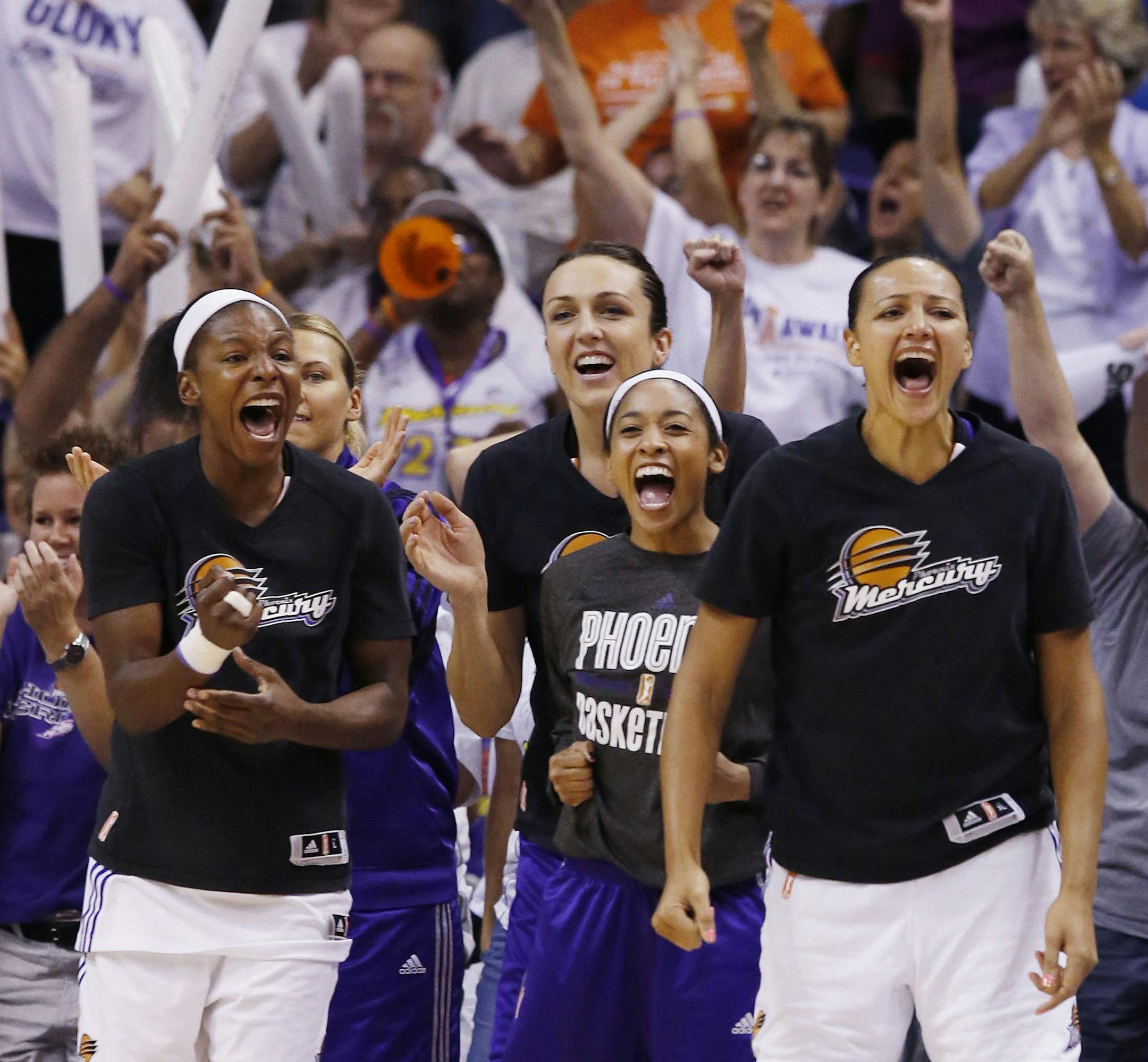 Phoenix Mercury's Eshaya Murphy, Ewelina Kobryn, Tiffany Bias, and Mistie Bass, froim left, cheer on their teammates during the first half of Game 3 in the WNBA Western Conference basketball finals against the Minnesota Lynx on Tuesday, Sept. 2, 2014, in Phoenix. (AP Photo/Ross D. Franklin)
