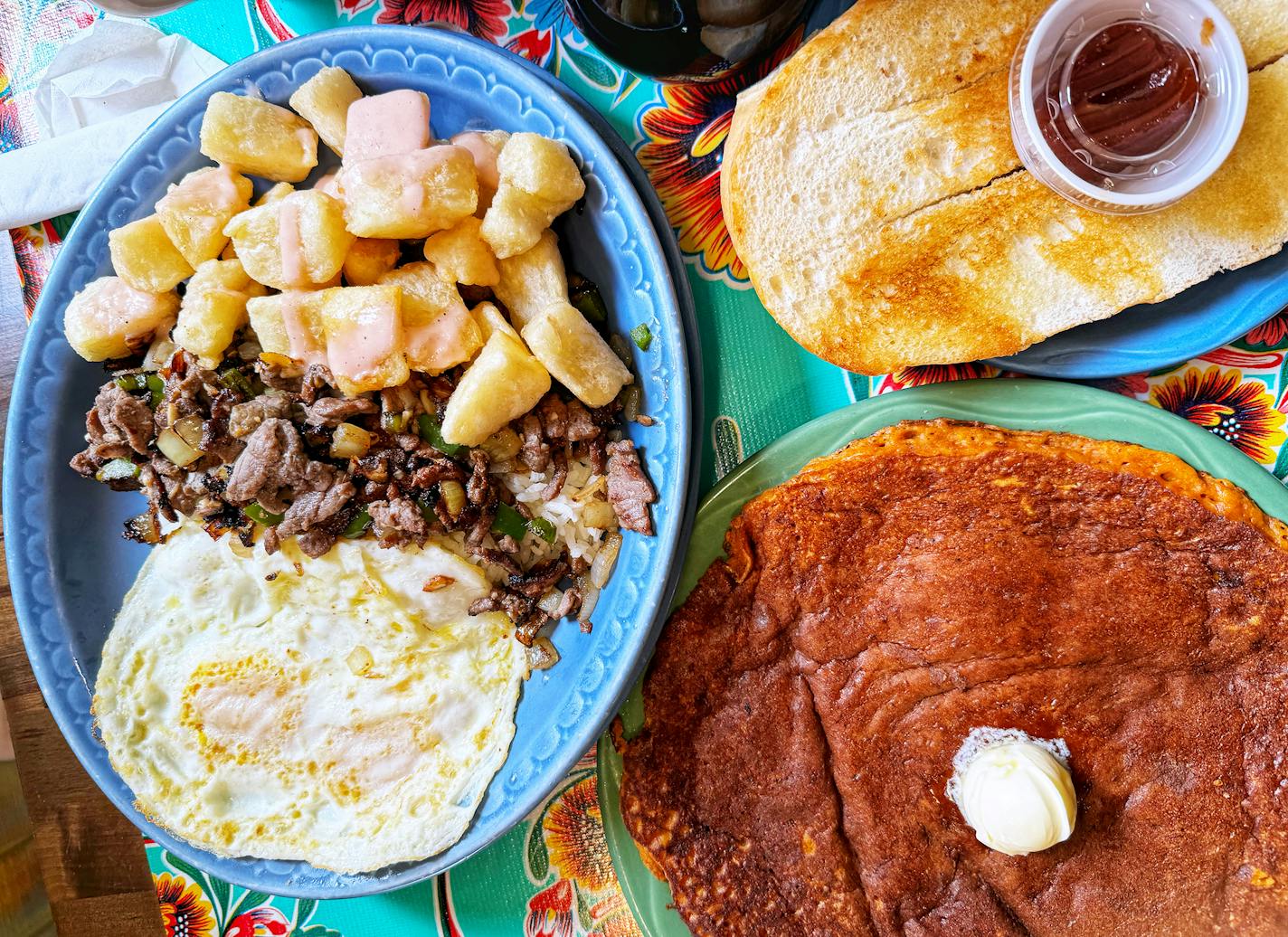 Bistec Criollo, Cuban bread and corn pancakes from Victor's 1959 Cafe. Credit: Jon Cheng