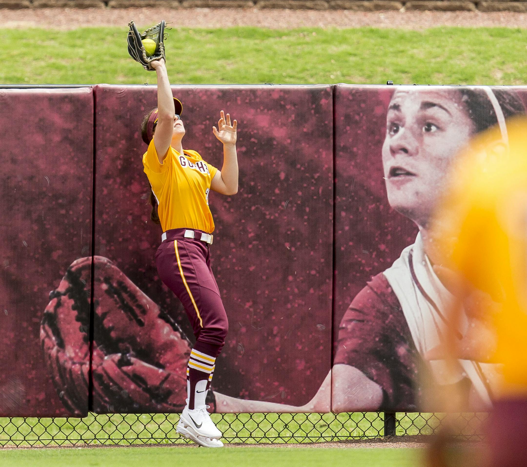 Minnesota's Maddie Houlihan (20) catches long fly ball hit by Alabama's Marisa Runyon in the NCAA regional softball tournament, Saturday, May 20, 2017, at Rhoads Stadium in Tuscaloosa, Ala. Alabama won 1-0. (Vasha Hunt/AL.com via AP)