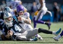 Vikings defensive tackle James Lynch (92) sacked Panthers quarterback Sam Darnold (14) in the first quarter, Sunday, October 17, 2021 in Charlotte.