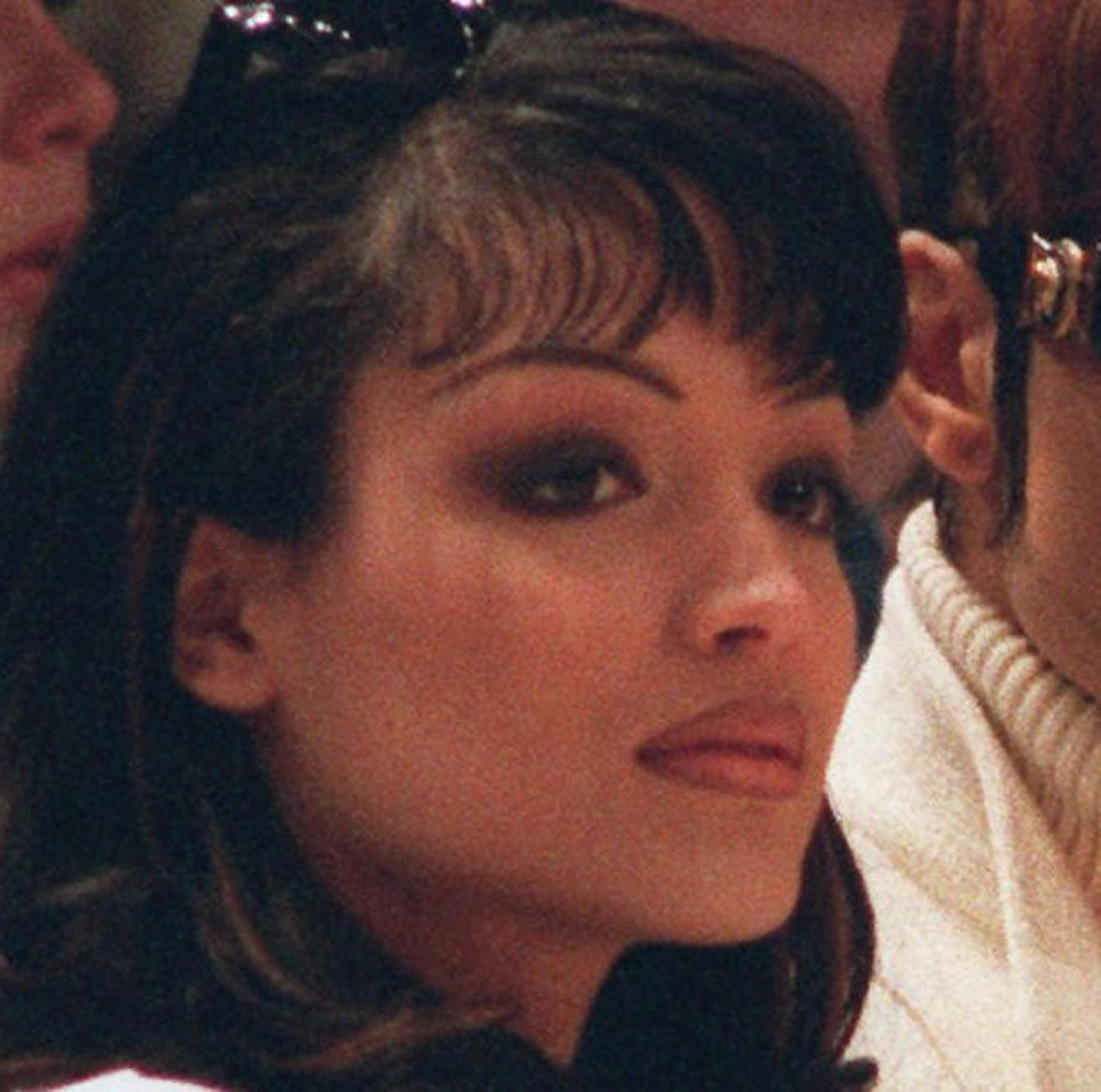 Mayte (white shirt, long dark hair) and the performer formerly known as Prince (wearing sunglasses) watch the New York Knicks play the Chicago Bulls at Madison Square Garden in New York Sunday, March 10, 1996. The Knicks won 104-72. The couple recently wed. (AP Photo/Anders Krusberg)