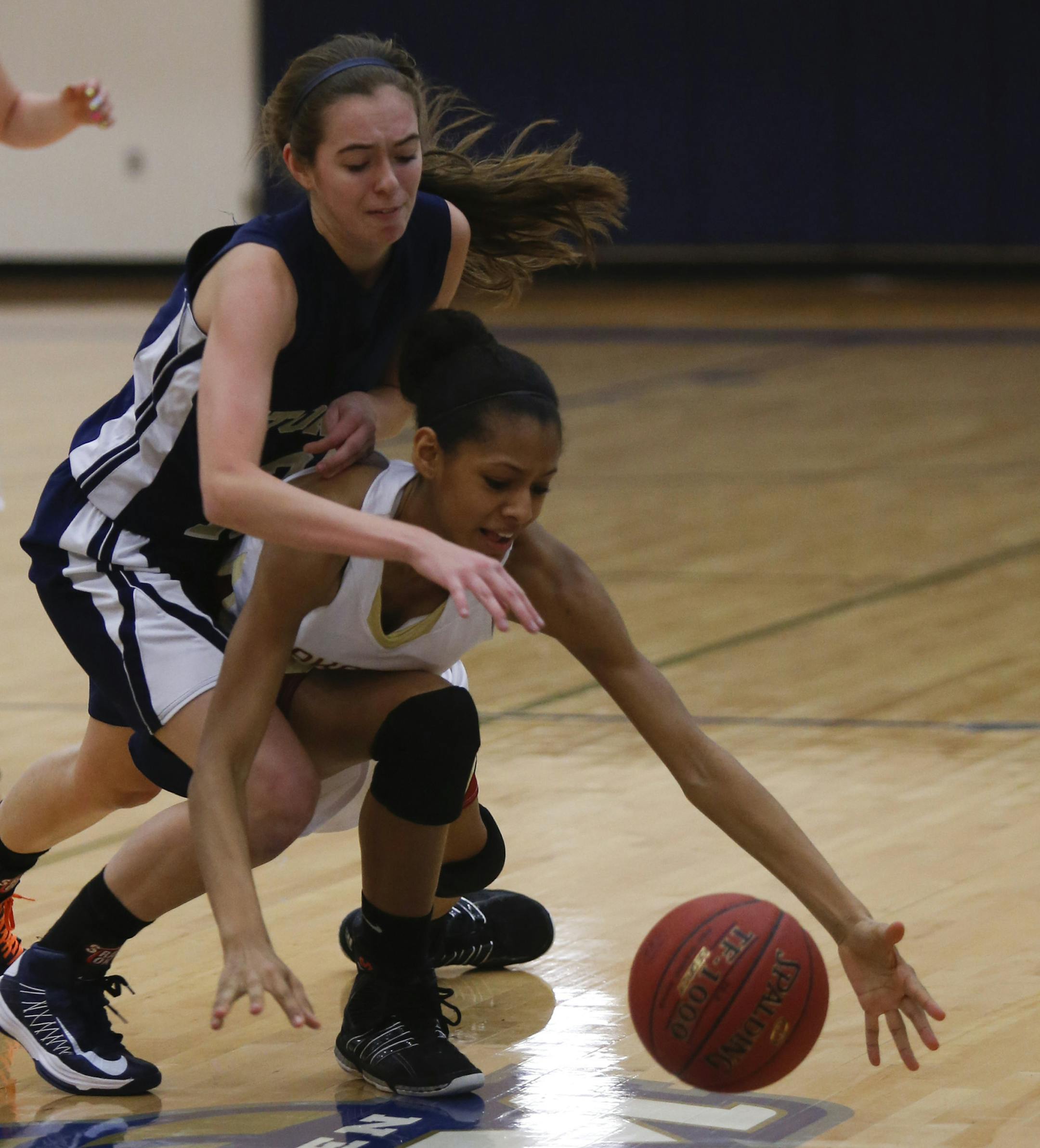 Lakeville South's Lela Sellers fought for possession of the ball with Chanhassen's Abby Rolf during sectional playoffs in Chanhassen, Min., Wednesday, February 27, 2013. ] (KYNDELL HARKNESS/STAR TRIBUNE) kyndell.harkness@startribune.com