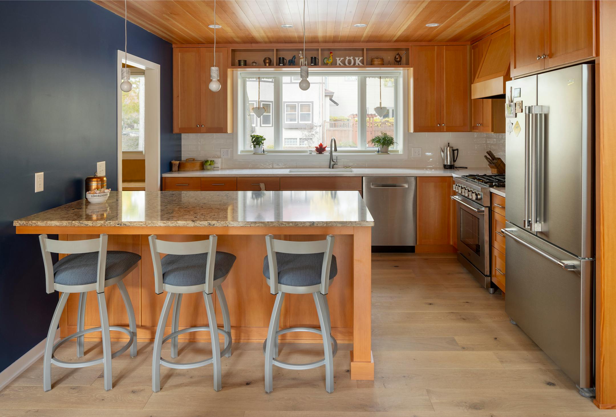 A grandmother wanted to be closer to her grandchildren, so she built a house in south Minneapolis right across the street from them. She wanted a small footprint that kept aging in place — and play spaces for the grandkids — in mind. The result is an energy-efficient house that also gives a nod to the homeowner’s Swedish heritage with a red exterior, decorative railings, richly stained woods and a blue tile fireplace surround. Meanwhile, a skylit loft serves as a playroom for the grandkids in this modern take on traditional Scandinavian design.