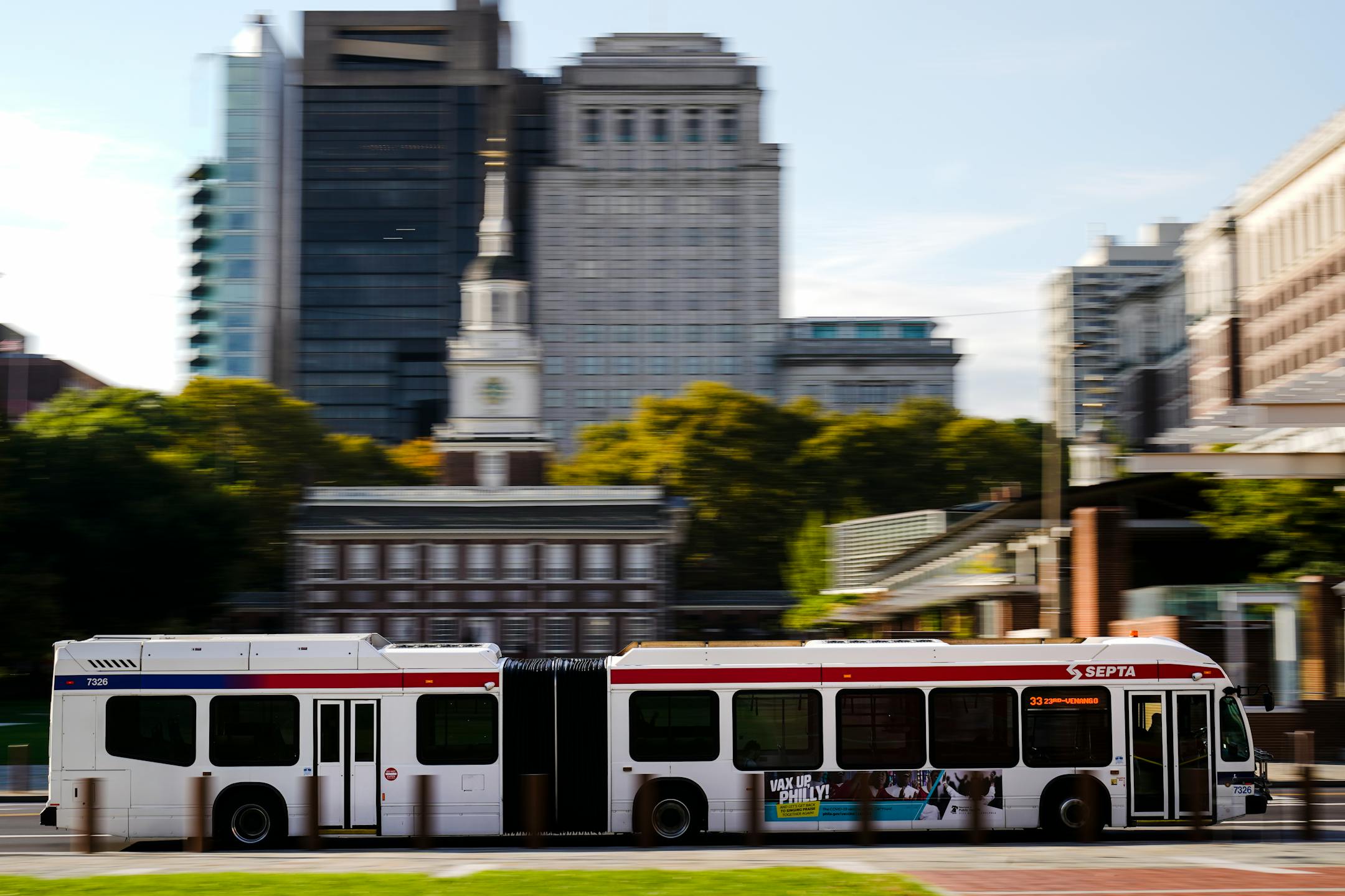 A Southeastern Pennsylvania Transportation Authority bus (SEPTA) is driven on Market Street in view of Independence Hall in Philadelphia, Friday, Oct. 22, 2021. (AP Photo/Matt Rourke)