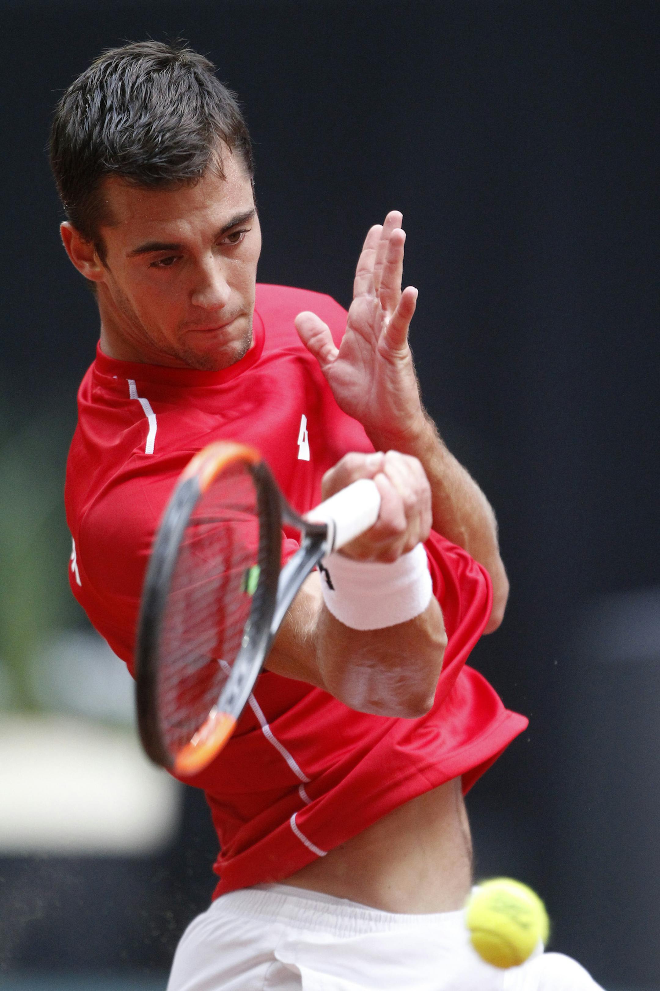 Laslo Djere of Serbia returns the ball to Jo-Wilfried Tsonga of France during their Davis Cup semi final at the Pierre Mauroy stadium in Lille, northern France, Friday, Sept.15, 2017. (AP Photo/Michel Spingler)