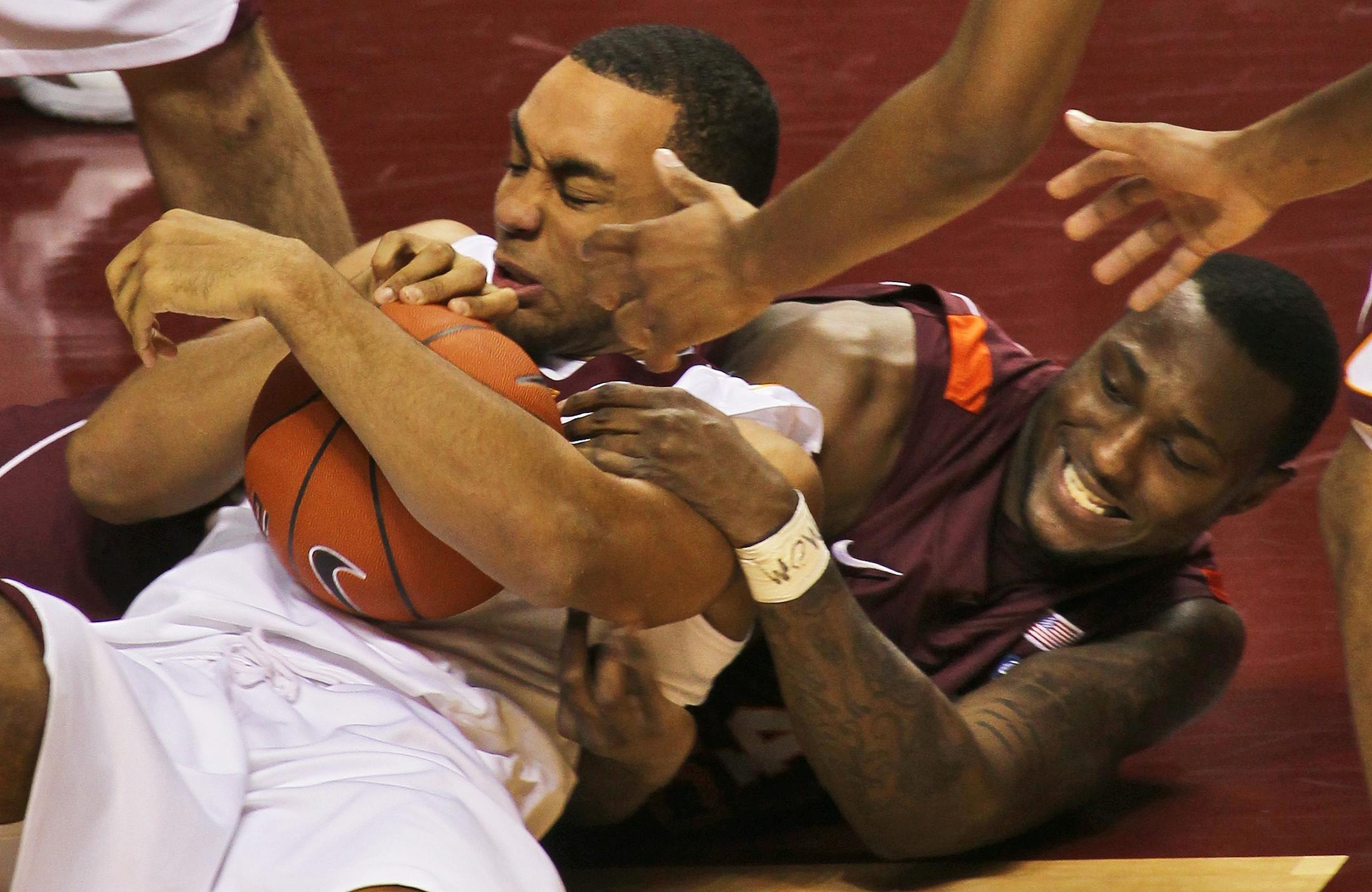 Minnesota's Joe Coleman, left, and Virginia Tech's Cadarian Raines fought for a rebound.