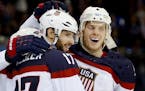 Ryan Kesler (17) and John Carlson (4) celebrated a goal by Kesler in the second period. USA beat Slovakia by a final score of 7-1.