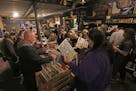 Customers fill Hymie's Record Store during the business's Record Store Day block party on Saturday, April 21, 2018 in Minneapolis.