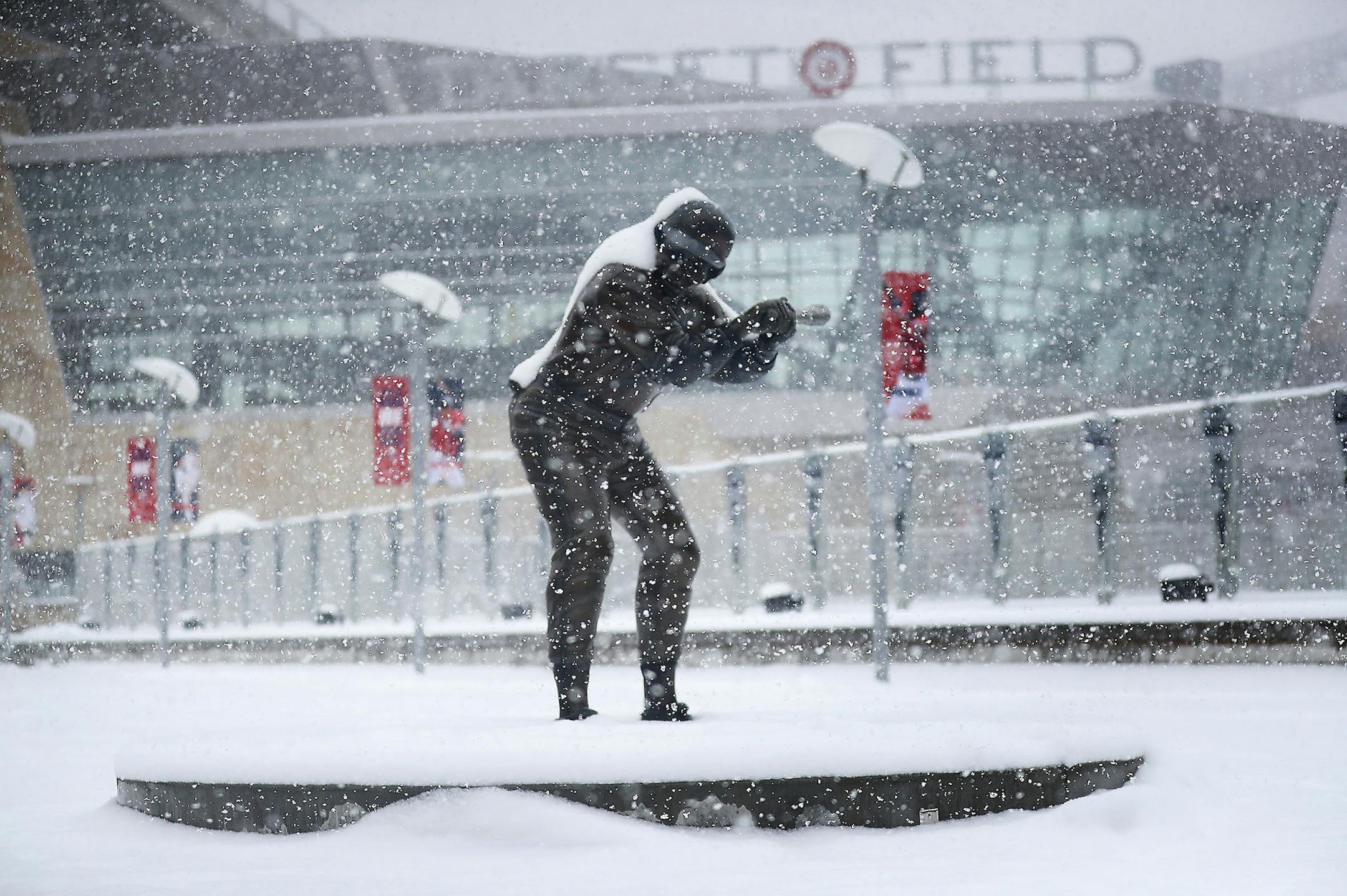 A statue of former Twin and multiple time All-Star selection Rod Carew is coated in fresh snow Tuesday, April 3, 2018, in Minneapolis, MN, hours before the Twins scheduled home opener at Target Field. The record for the Twins' coldest home opener is 34 degrees against the Los Angeles Angels in 1962 and the forecast high for Wednesday is for the low 30s. ] DAVID JOLES &#xef; david.joles@startribune.com The snow keeps falling.