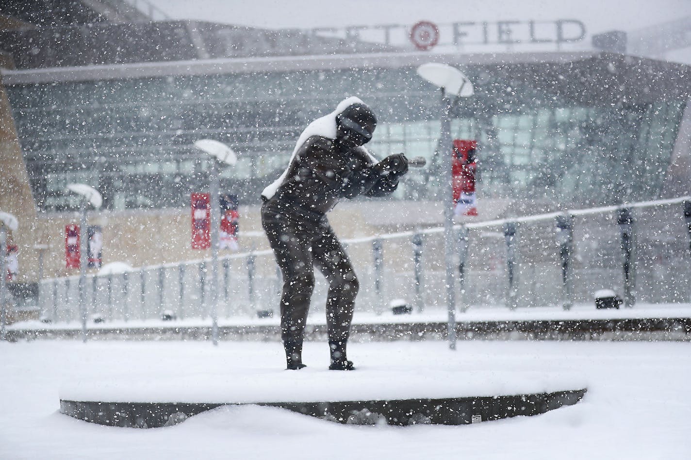 A statue of former Twin and multiple time All-Star selection Rod Carew is coated in fresh snow Tuesday, April 3, 2018, in Minneapolis, MN, hours before the Twins scheduled home opener at Target Field. The record for the Twins' coldest home opener is 34 degrees against the Los Angeles Angels in 1962 and the forecast high for Wednesday is for the low 30s. ] DAVID JOLES &#xef; david.joles@startribune.com The snow keeps falling.